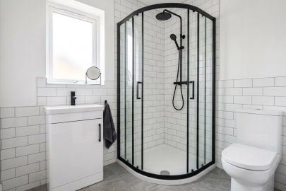 an image showing a black quadrant enclosure fitted into small bathroom | Article Image