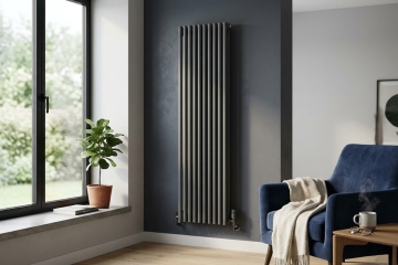 An image showing a black designer vertical radiator on a dark coloured wall in a living room | Article Image
